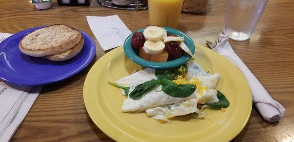 Garden Omelette with egg whites and only spinach and mushrooms with an English muffin and a side of fruit.