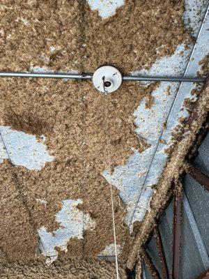 Broken outlet and ceiling insulation crumbling