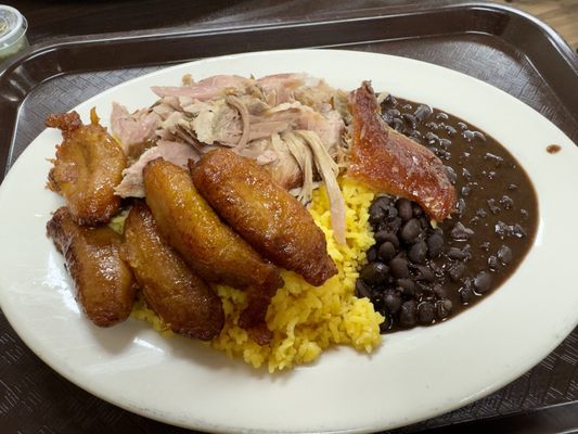 Roast pork dinner special with a side of maduros.