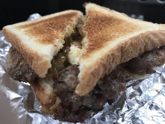 Onion sausage egg and cheese sandwich