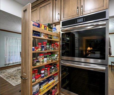 Pictured is a customer favorite, the Wood Pantry Pullout Cabinet seen in maple wood with a soft stain finish.