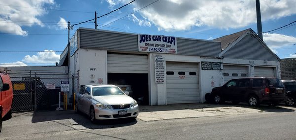 Joe's Car Craft. Right after the cement drain cylinders on your right going east.