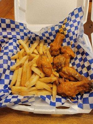 Six piece buffalo wings and fries.