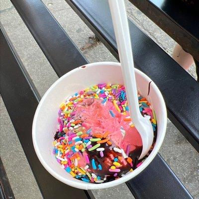 Crazy cotton candy with hot fudge and rainbow sprinkles