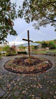 View of our building from the memorial gardens with a rainbow shining overhead.