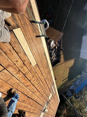 Lighter areas show where we replaced the necessary wood on the roof decking, so we can officially begin roof installation.