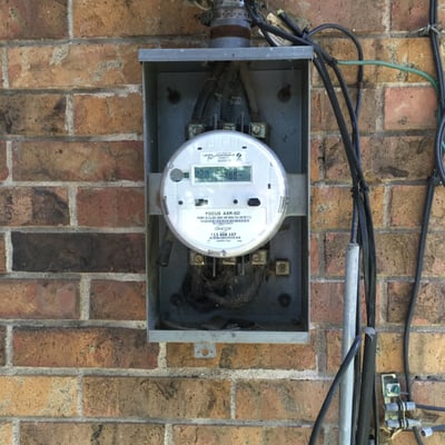 New Oncor Electric Delivery smart meter & 1963 model meter base that we upgraded recently.