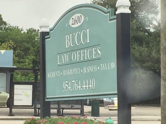 Details of Bucci Law Offices sign on corner of N. Andrews / NE 26 Ave.