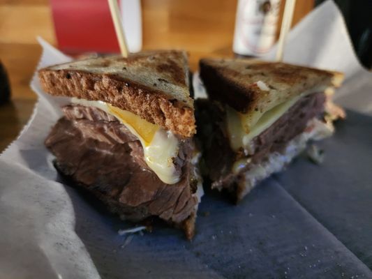 Brisket Reuben sandwich with onion rings - would have been better with leaner brisket