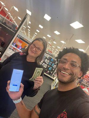 A satisfied customer getting PAID cash for her S23 Ultra