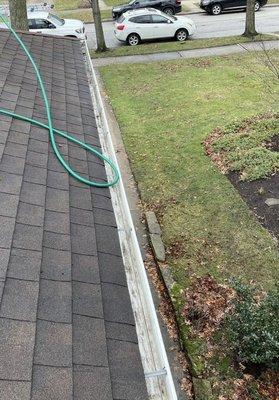 Gutter cleaning and flushed gutters and unclogged downspouts