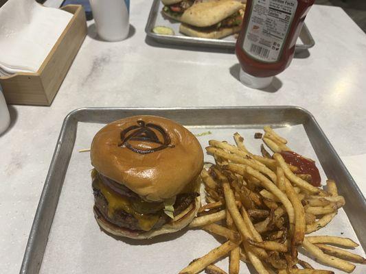 Cheese burger medium rare and fries.