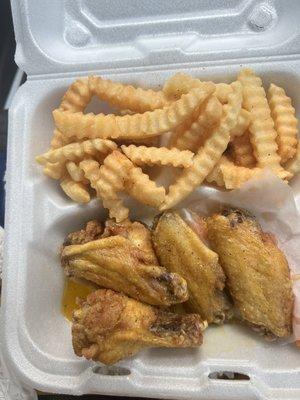 Lemon pepper wings and crinkle fries