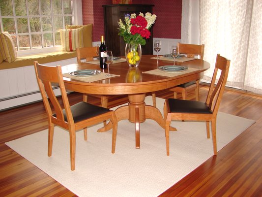 Pedestal dining table and chairs in cherry