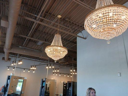 I love a pretty chandelier! Stylists stations in the background.