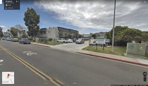 Google image of the parking lot and the entrance of the building