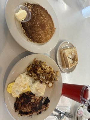 Pancake, two eggs over easy, corned beef hash and home fries.  Side of toast