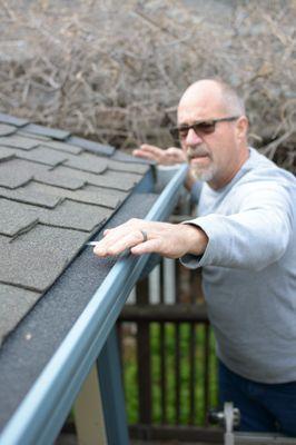 Barry installing Gutter Guard