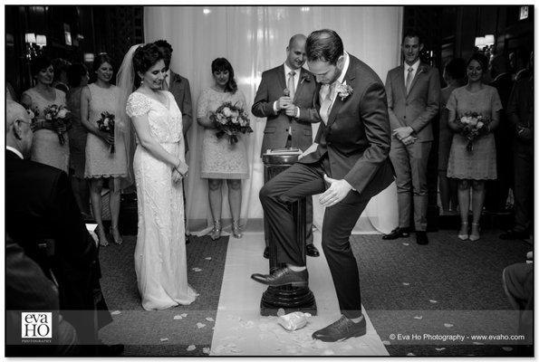 Groom stomping on the glass in a Jewish ceremony.