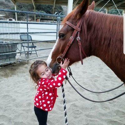 Our youngest student thanking Scarlet for a great ride