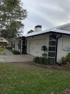 Metal roof with black gutters