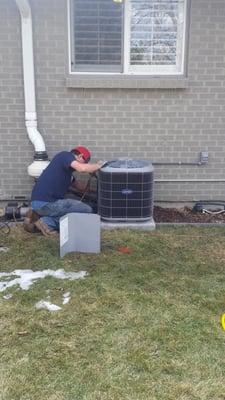 Ryan installing a Carrier Comfort 13 Central Air Conditioner