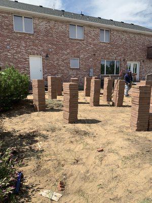 Clean up and piled up old pavers