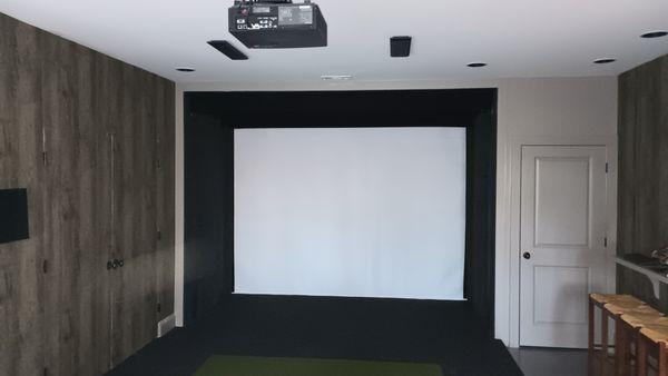 Golf simulator / Projection theatre room with hidden rear closet for equipment