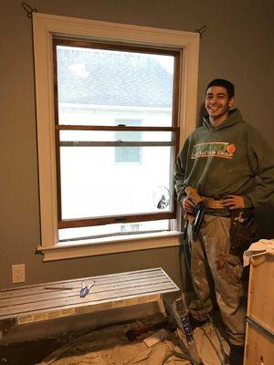 My son installing new trim molding and casing around all windows.