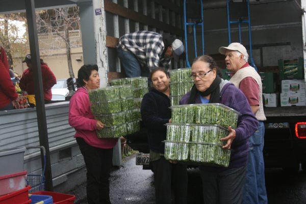 Community people preparing for the Friday food distribution.