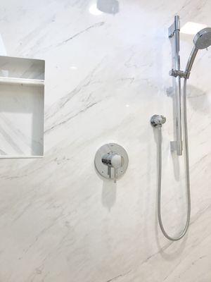 Porcelain sheets for shower walls. No grout to clean. Still love it after 4 years