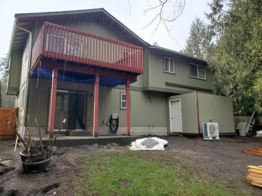 Started with small concrete patio and uncovered upper deck.