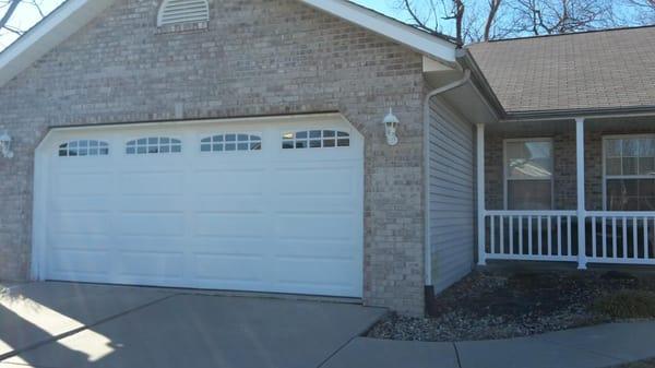 A new garage door installation. We installed a insulated garage door with optional glass in the top panel.