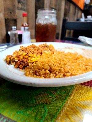 Huevos con chorizo, rice, and beans.