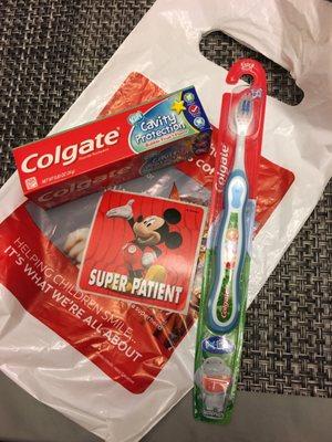 Gotta love their kiddie goodie bag complete with kids toothbrush, kids fruit flavor toothpaste, and sticker!