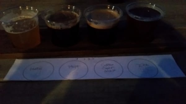 Flight of Hefeweizen, Dry Irish Stout, coffee cream stout on nitro, and Peregrine IPA