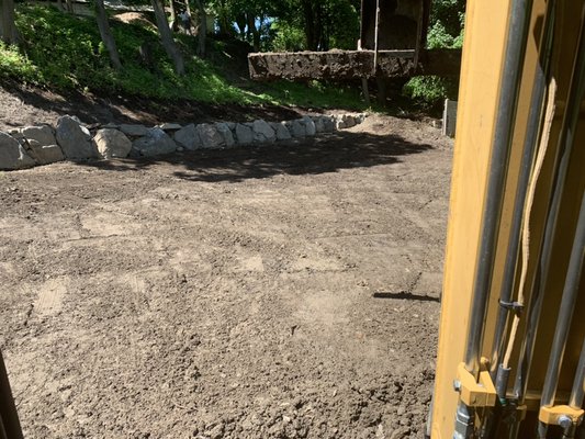 Natural boulder wall and grading