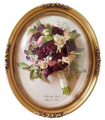 Gorgeous Antique Gold oval frame with acrylic dome.  Preserved wedding bouquet.