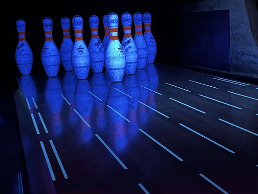 Cosmic Bowling with neon colors and black lights.