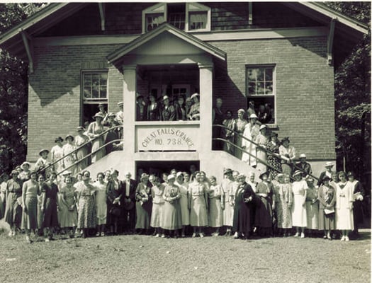 Historic photo of Great Falls Grange next door to library.