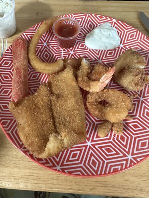 Flounder, shrimp, crab stick and onion rings.