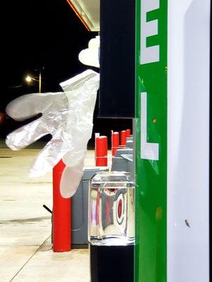 Fuel gloves flapping in the wind at CIRCLE K/FLASH FOODS in Thomaston, Georgia.