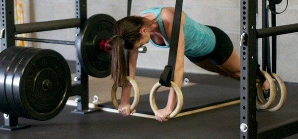 Personal trainer Taylor H. making sure to practice what she preaches on the gymnastics rings