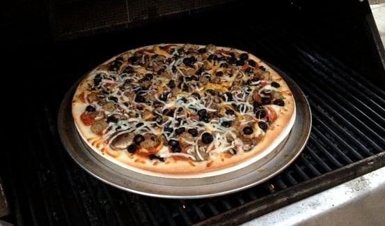 You can grill our pizzas! Over low heat, use a pizza stone or pan, and rotate the pizza every couple of minutes. Wow!!