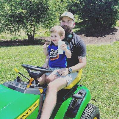 My oldest and I cuttin' our lawn on the ol John Deere.