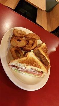 Hot ham and cheese sandwich with onion rings cooked to order.