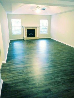 The corrected floors and trim around fireplace. Very Nice!