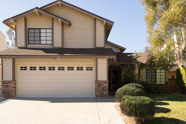 This two story home was in need of an exterior update. Fresh paint, new stucco and stone made this house look new again with a modern look.