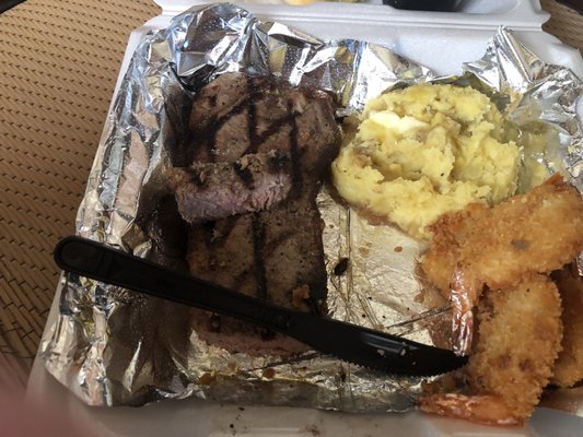 My order. Strip steak mash potatoes and butterfly shrimp