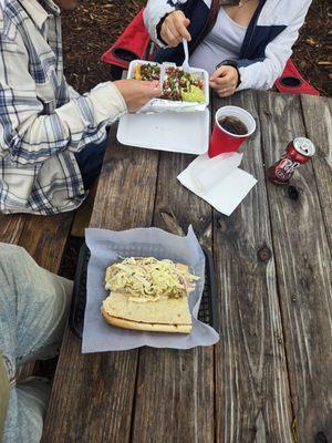 Messi- Named after Lionel Messi  (sandwich on bottom with curtido (coleslaw?) And Argentina shrimp, super bomb! )